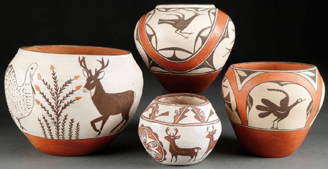 A GROUP OF FOUR SOUTHWEST POLYCHROME POTTERY BOWL: A GROUP OF FOUR SOUTHWEST POLYCHROME POTTERY BOWLS, CIRCA 1935-1975. Comprising three Zia bowls and a small Zuni bowl with heart-lined deer decoration signed on bottom Mrs. Cecil Vicenti, height 4 inc