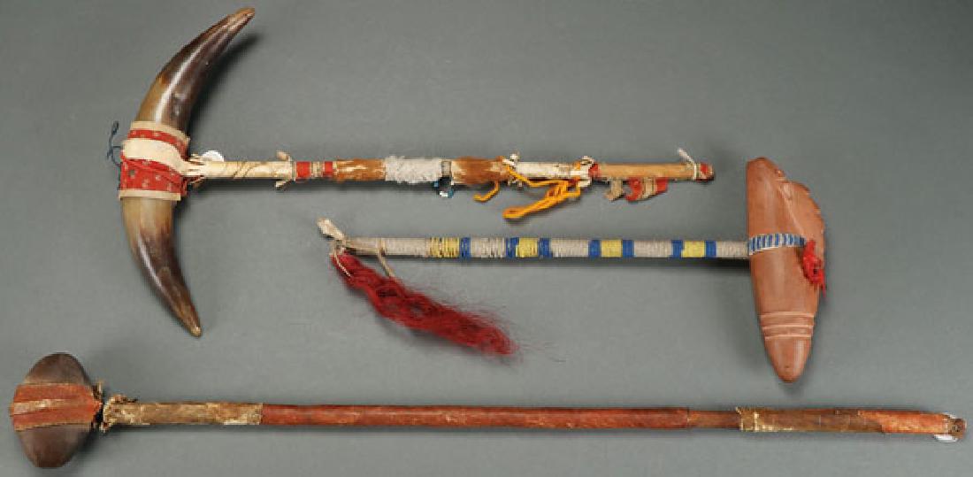A PLAINS DANCE WAND AND TWO WAR CLUBS, CIRCA 1900 (1 of 1)
