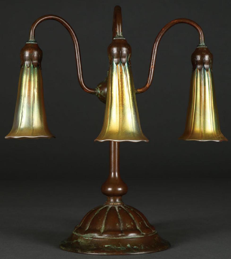 A TIFFANY BRONZE THREE LILY LAMP, EARLY 20TH C (1 of 5)