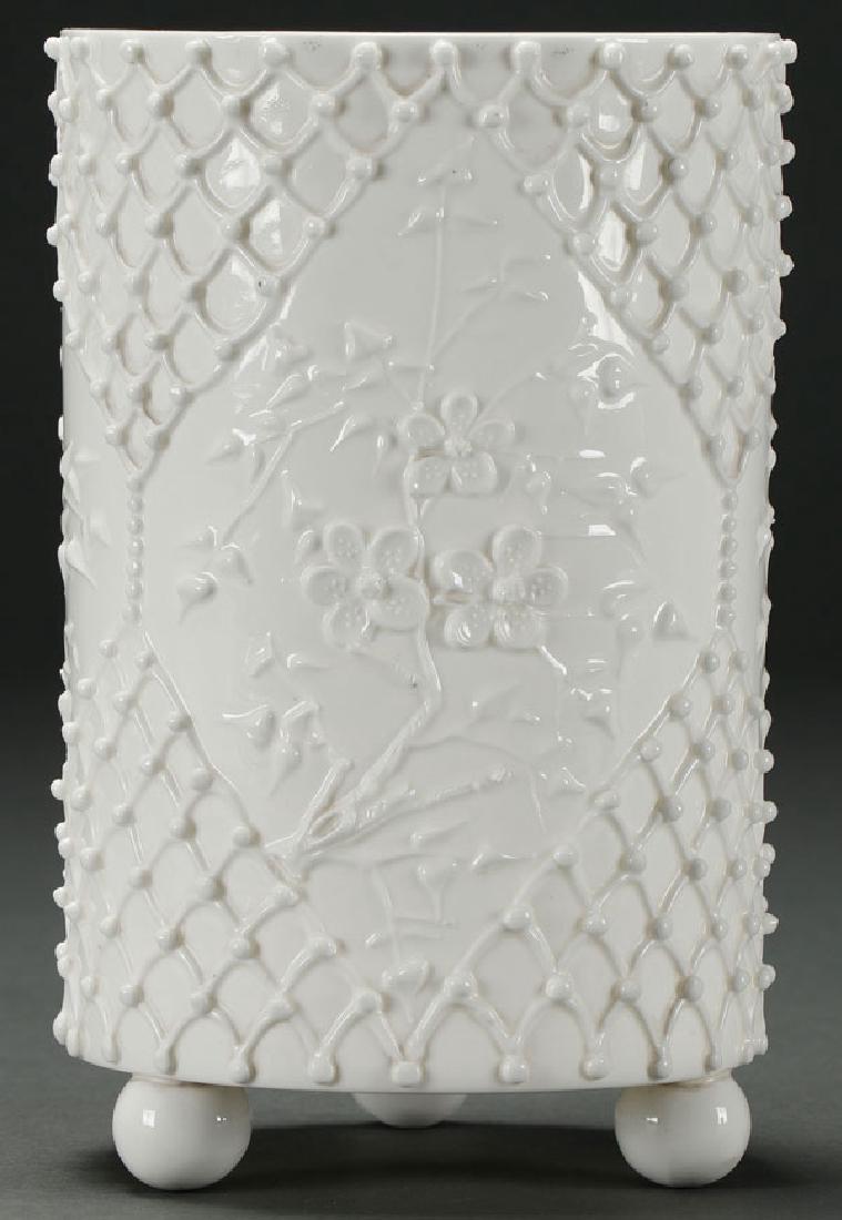 A KNOWLE TAYLOR KNOWLES "LOTUS WARE" PORCELAIN: A KNOWLE TAYLOR KNOWLES "LOTUS WARE" PORCELAIN FOOTED VASE, EARLY 20TH CENTURY. Of cylindrical form with embossed lattice and cherry blossoms. Green back stamp on base. Height 8 inches (20.3 cm). SH