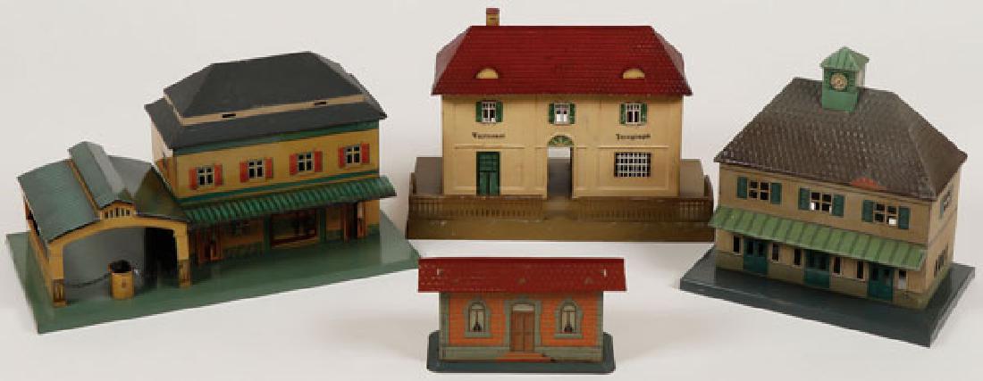 FOUR GERMAN TIN LITHO TOY TRAIN STATIONS (1 of 7)