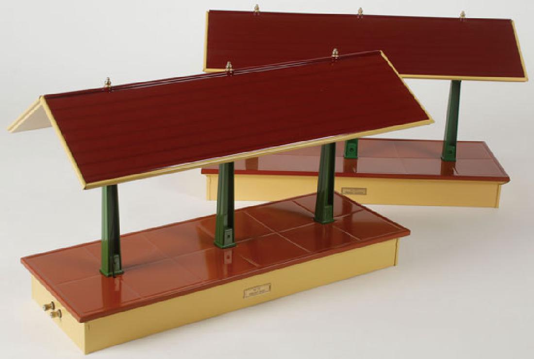 A PAIR OF MTH STANDARD GAUGE #151 FREIGHT SHEDS: A PAIR OF MTH STANDARD GAUGE #151 FREIGHT SHEDS, LATE 20TH CENTURY. Each in new unused condition and with original boxes. Length 18 inches. SHIPPING NOTICE: Jackson's is your sole and only so