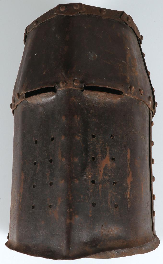 MEDIEVAL STYLE HAND FORGED IRON HELMET: MEDIEVAL STYLE HAND FORGED IRON HELMET. Heavily riveted, the front with ventilation and eye slits, probably Victorian. Height 13 inches (33 cm). SHIPPING NOTICE: Jackson's is your sole and