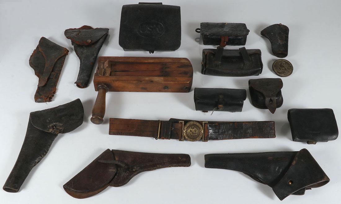 US CIVIL WAR LEATHER AND OTHER RELATED ITEMS: A GROUP OF U.S. CIVIL WAR LEATHER AND OTHER RELATED ITEMS. Comprising six leather holsters, one stamped U.S. in oval and the other U.S.N, together with various cartridge and cap boxes including three 