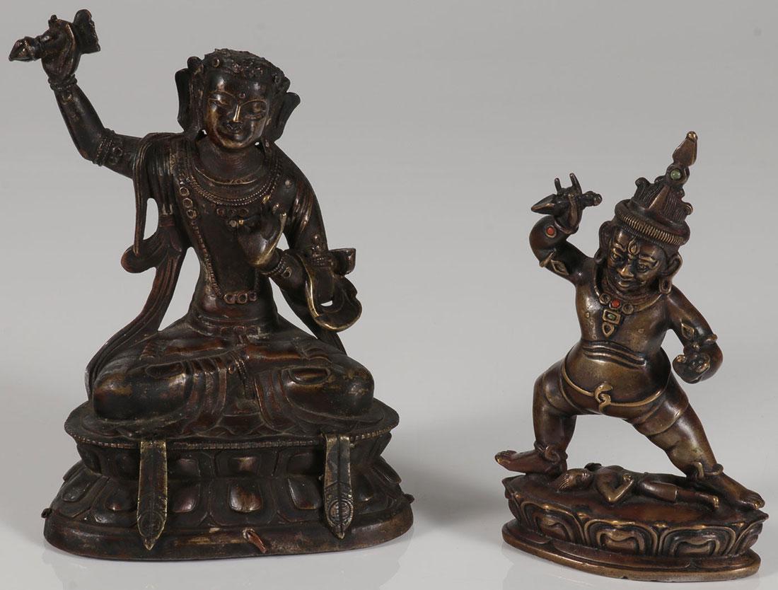A PAIR OF SINO-TIBETAN BRONZE BUDDHIST DEITIES: A PAIR OF SINO-TIBETAN BRONZE BUDDHIST DEITIES, 18TH AND 19TH CENTURY. The largest on a double lotus throne and the other on single lotus base and the figure with cabochons, both with sealed bases and