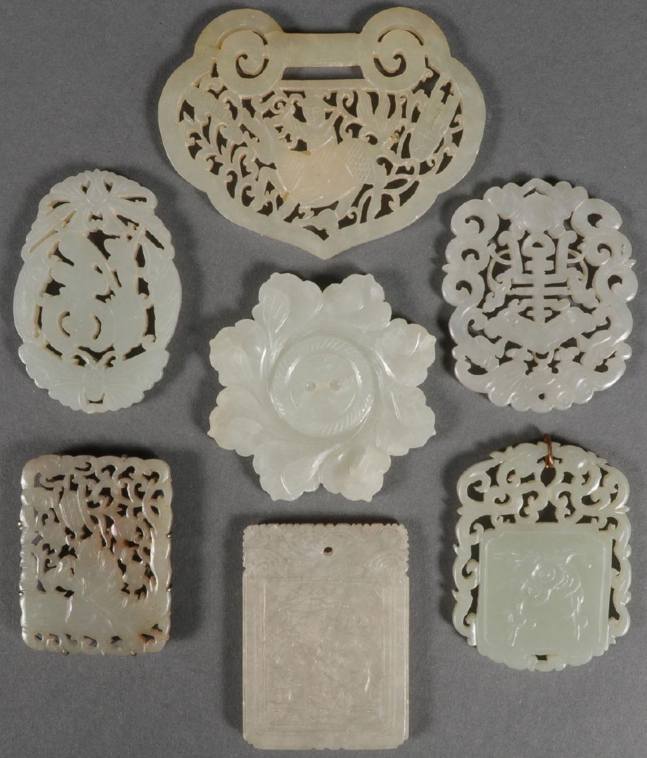 7 CHINESE JADE & HARDSTONE PENDANTS, QING DYNASTY: A GROUP OF SEVEN CHINESE CARVED JADE AND HARDSTONE PENDANTS, QING DYNASTY. Comprising five finely carved open work pendants and two solid forms. Greatest measurement 3.25 inches (8 cm).SHIPPING NOTI