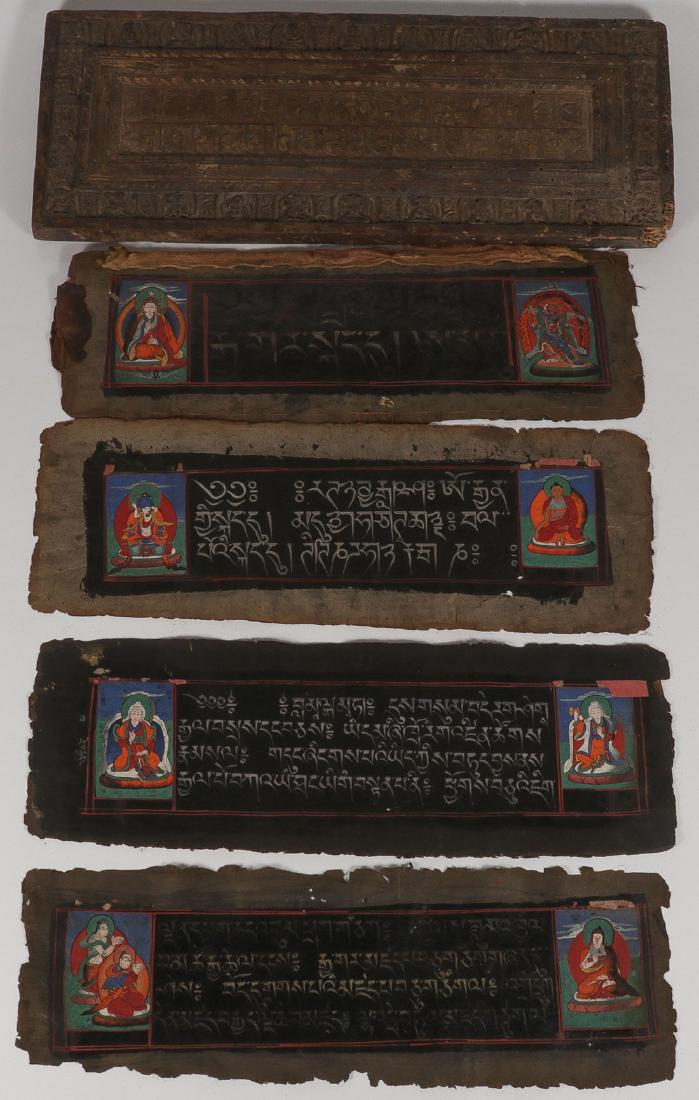 A TIBETAN/HIMALAYAN SUTRA WITH COVERS: A TIBETAN/HIMALAYAN SUTRA WITH COVERS, 18TH/19TH CENTURY. The front cover carved in high relief with the borders depicting 26 distinct Buddhist deities and the central recessed area carved in high rel