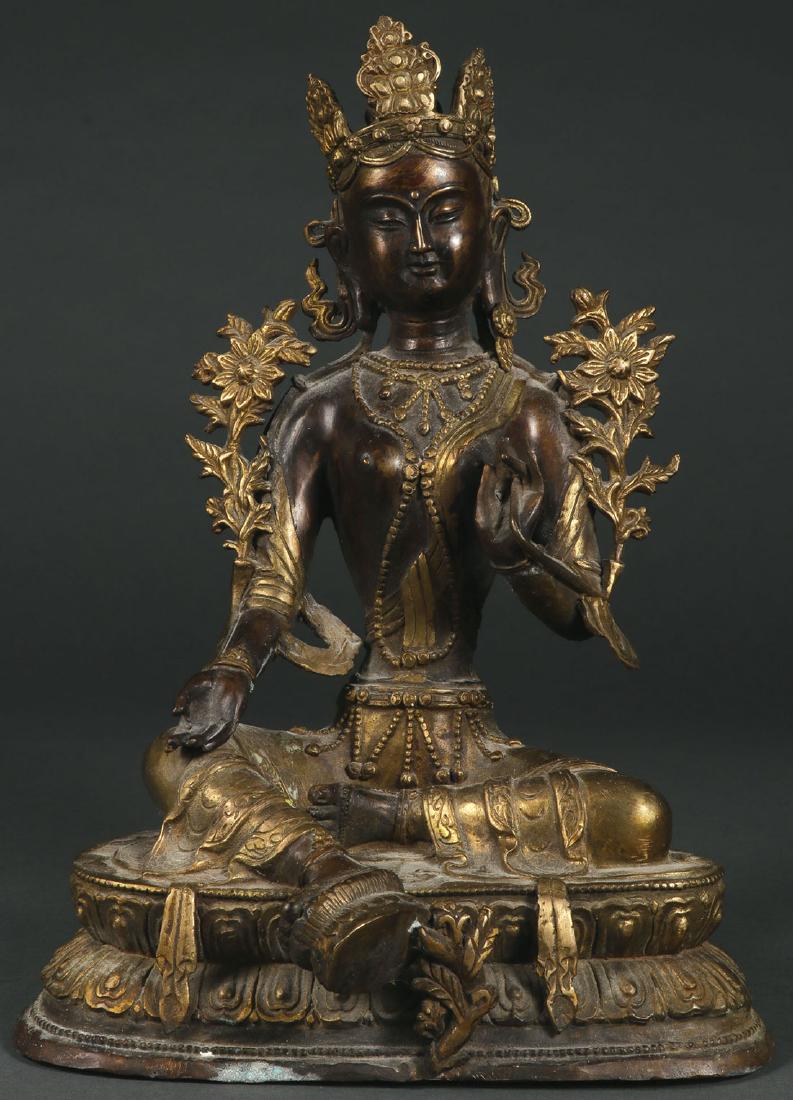 A CHINESE BRONZE BUDDHIST DEITY: A CHINESE BRONZE BUDDHIST DEITY 2ND HALF OF 20TH CENTURY. The figure resting on a double lotus throne and the base sealed. Height 13.5 inches (34.5 cm). SHIPPING NOTICE: Jackson's is your