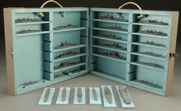 U.S. NAVY WWII MINIATURE SHIP MODELS dated 1943,: U.S. NAVY WWII MINIATURE SHIP MODELS dated 1943, including 25 individual ships ranging from 3 inches to 7 inches in length (British) contained in custom fitted case with official Naval I.D. tag. Case