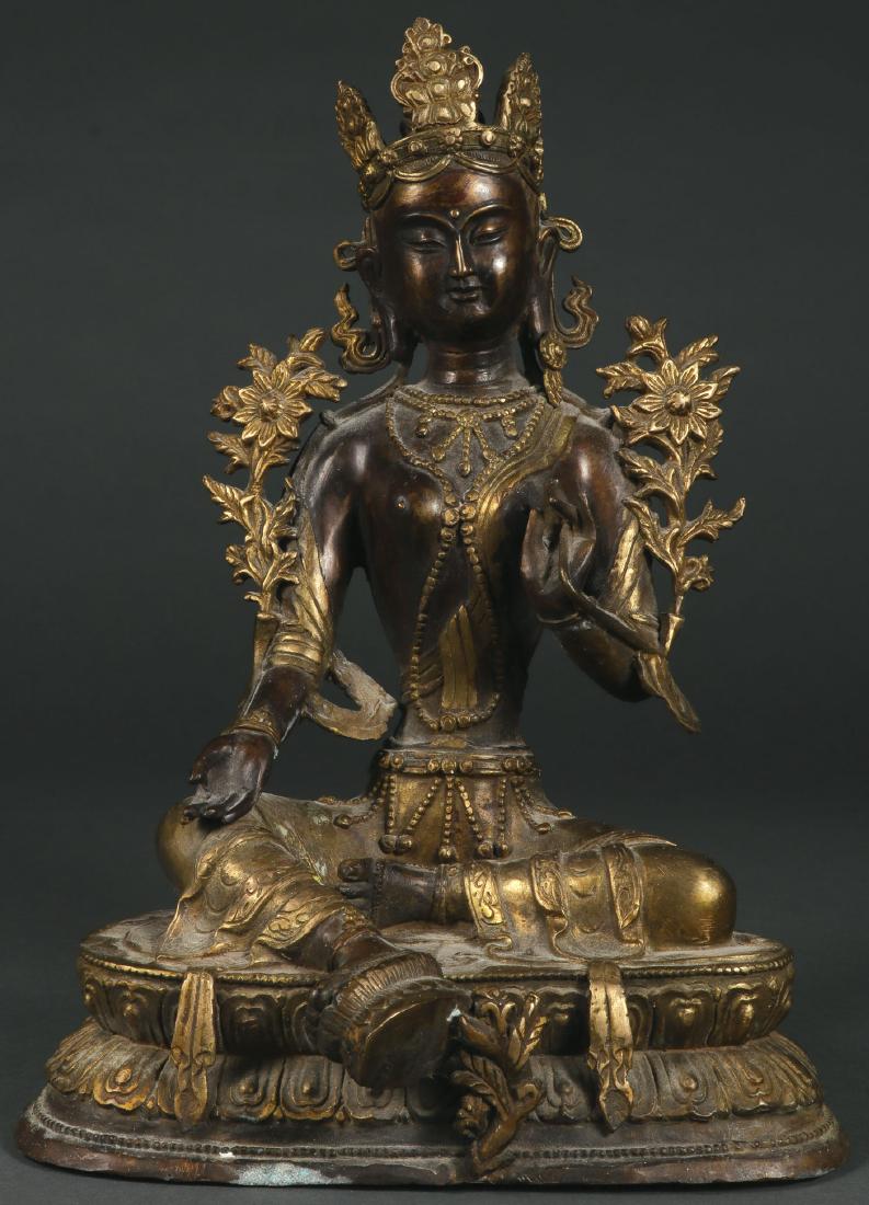 A BRONZE BUDDHIST DEITY, 2ND HALF OF 20TH C.: A CHINESE BRONZE BUDDHIST DEITY, 2ND HALF OF 20TH CENTURY. The figure resting on a double lotus throne and the base sealed. Height 13.5 inches (34.5 cm).