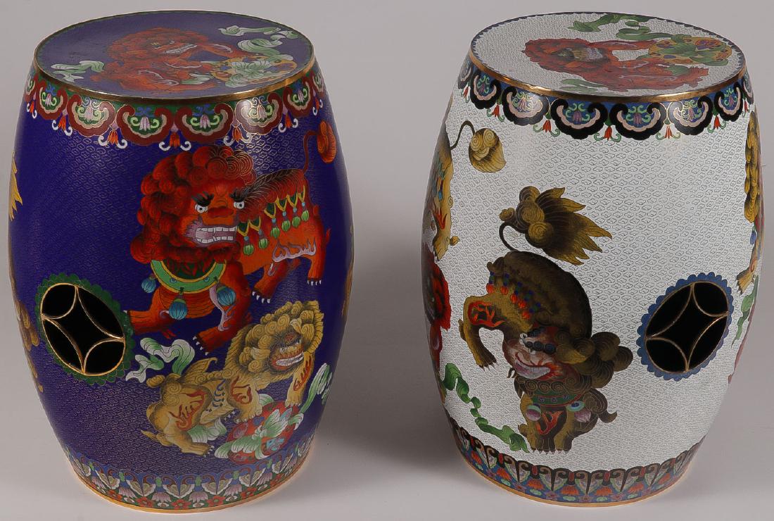 A PAIR OF CHINESE CLOISONNE GARDEN STOOLS: A PAIR OF CHINESE CLOISONNE GARDEN STOOLS. Each with Foo lion design having pierced medallions on sides rising on a circular foot. Height 18.5 inches (47 cm).