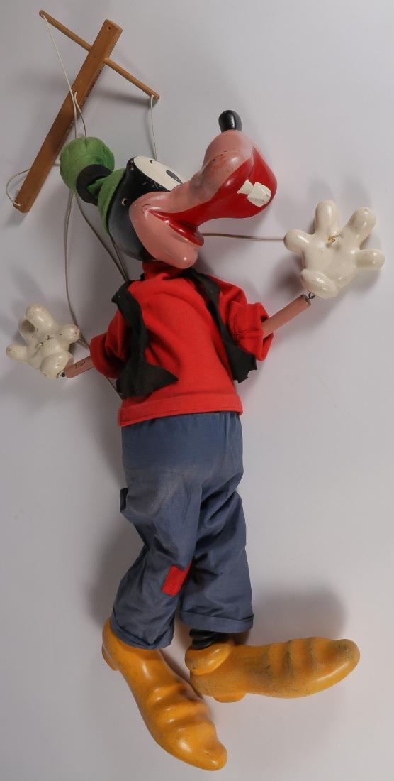 LARGE PELHAM FOR DISNEY GOOFY MARIONETTE: A LARGE PELHAM GOOFY MARIONETTE, CIRCA 1950. A wood and composition marionette puppet of the Walt Disney character Goofy. Needs re-strung. Height 38 inches (96.5 cm).