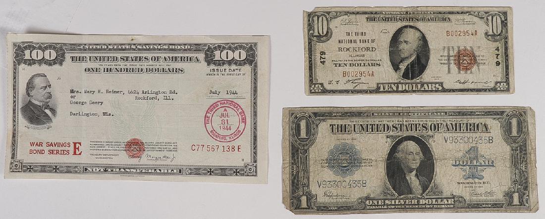 A GROUP OF US PAPER CURRENCY AND A WAR BOND: A GROUP OF US PAPER CURRENCY AND A WAR BOND. Comprising a US ten dollar note series 1929 and a US one dollar note series 1923. Together with a 1944 US war savings bond series E 100 dollar savings bond