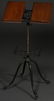 ANTIQUE CAST IRON AND OAK BOOK STAND.