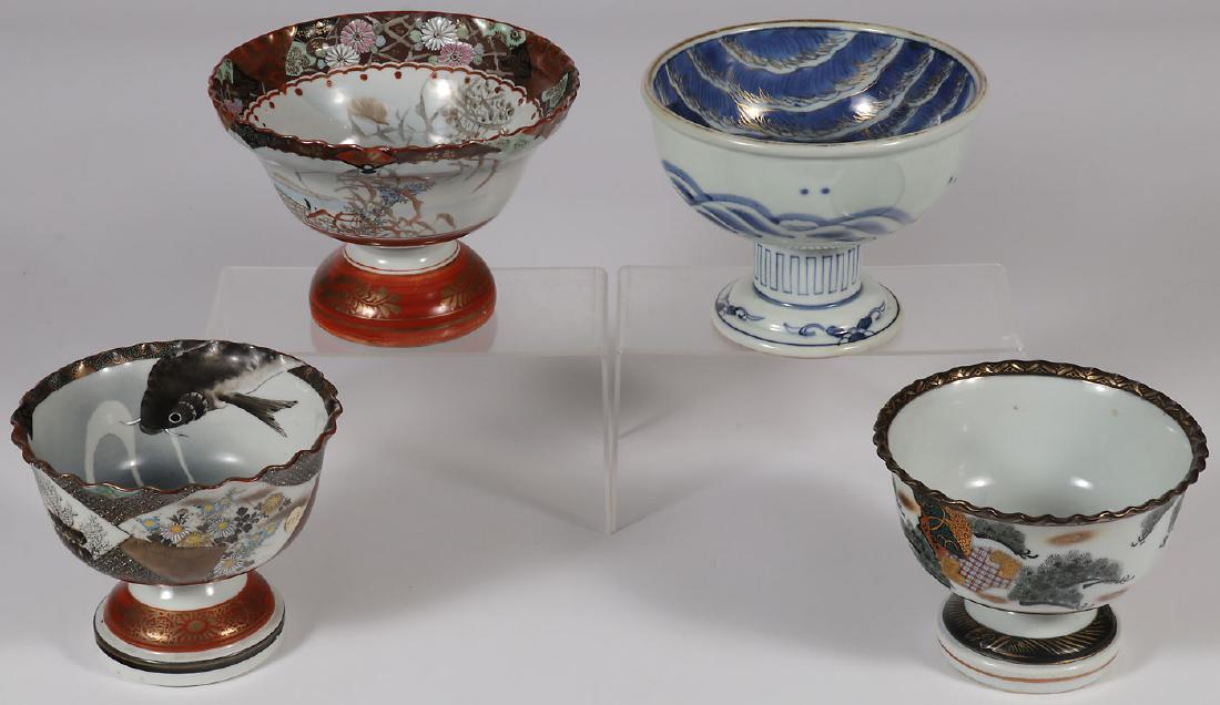 FOUR JAPANESE IMARI FOOTED BOWLS EDO-MEIJI PERIOD: FOUR JAPANESE IMARI FOOTED BOWLS, EDO - MEIJI PERIOD. Of various shapes, some with scalloped rim and three with marks on underside of base. Greatest diameter 7 inches (18 cm), greatest height 5 inches