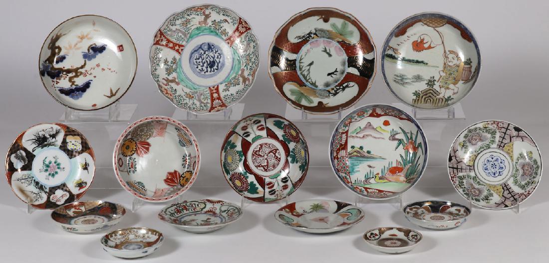 15 JAPANESE IMARI PORCELAINS, EDO - MEIJI PERIOD: 15 JAPANESE IMARI PORCELAIN PLATES AND BOWLS, EDO - MEIJI PERIOD. Of various sizes, shapes, and decoration including bowls, plates, and saucers. Greatest diameter 9.75 inches (25 cm).