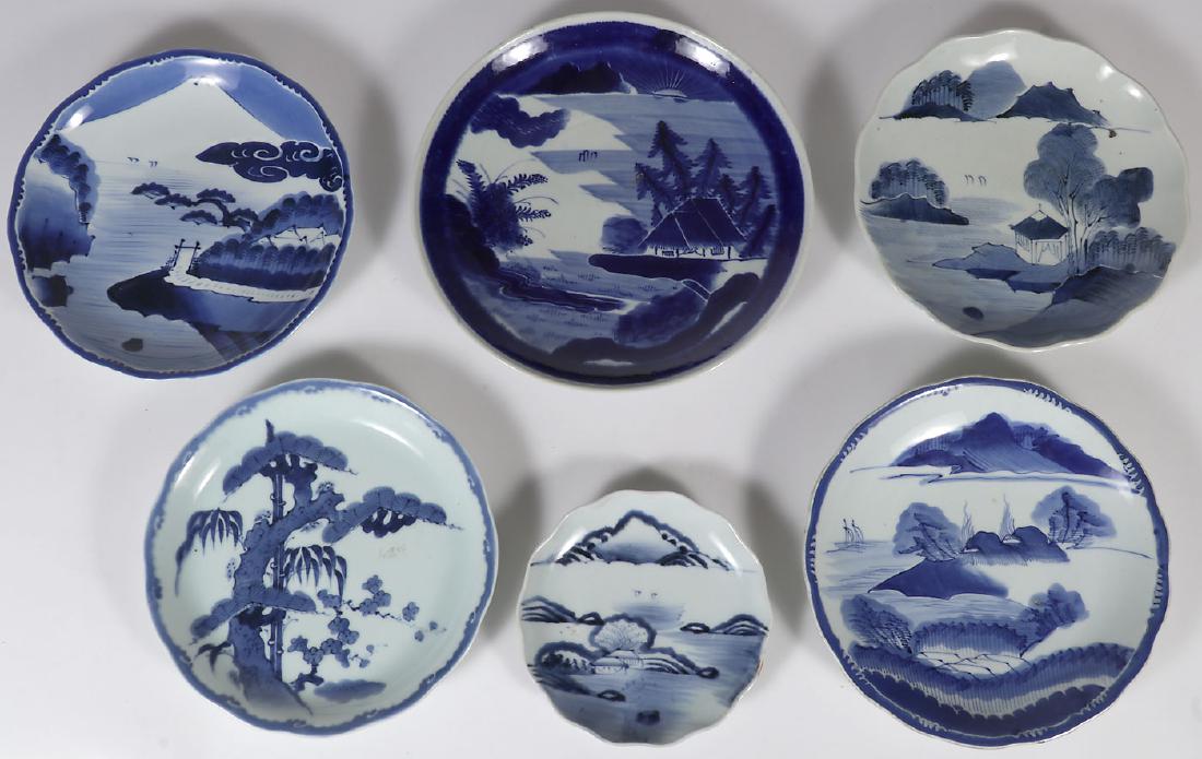 FIVE JAPANESE IMARI PORCELAIN CHARGERS, EDO-MEIJI: FIVE JAPANESE IMARI PORCELAIN CHARGERS, EDO - MEIJI PERIOD. All decorated in blue and white of various configurations. Greatest size 13.25 inches (33.5 cm). Together with an Imari blue and white decor