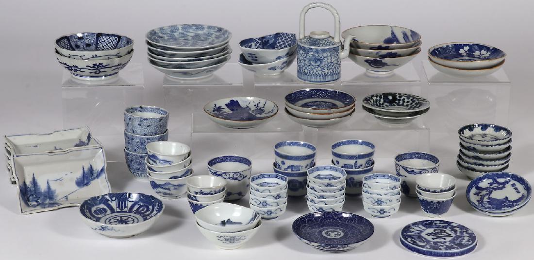 73 PIECES OF JAPANESE IMARI PORCELAIN, EDO-MEIJI: 73 PIECES OF JAPANESE IMARI PORCELAIN, EDO â€“ MEIJI PERIOD. Comprising various bowls, cups, plates, and trays, many with blue underglaze mark, and including four matching groups comprising five 