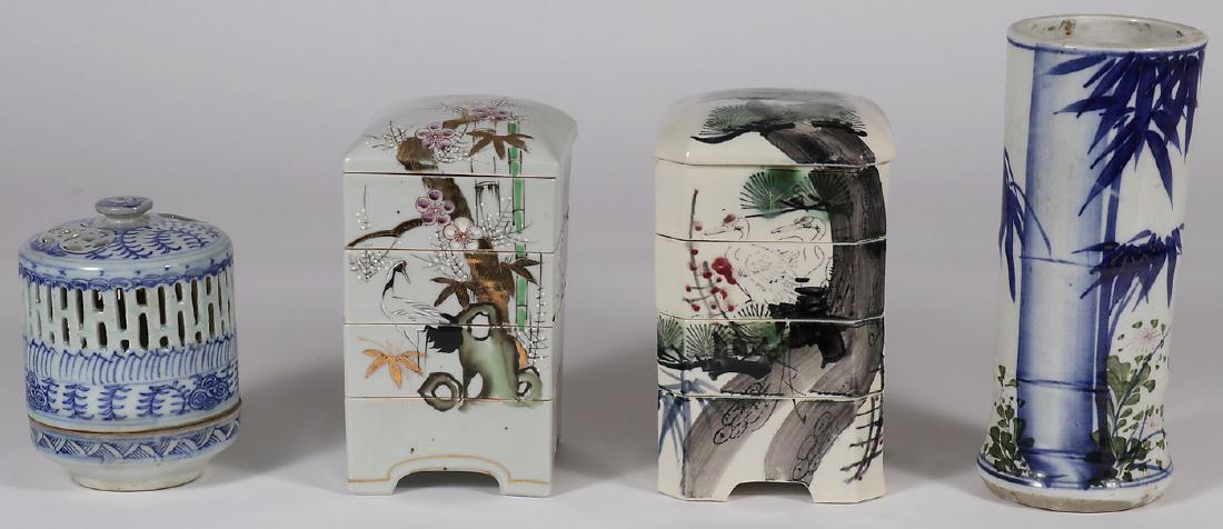 JAPANESE PORCELAIN AND CERAMICS: JAPANESE PORCELAIN AND CERAMICS. Comprising two stacking bowl sets, an incense burner, and a bamboo style cylindrical vase. Greatest height 12 inches (30.5 cm).