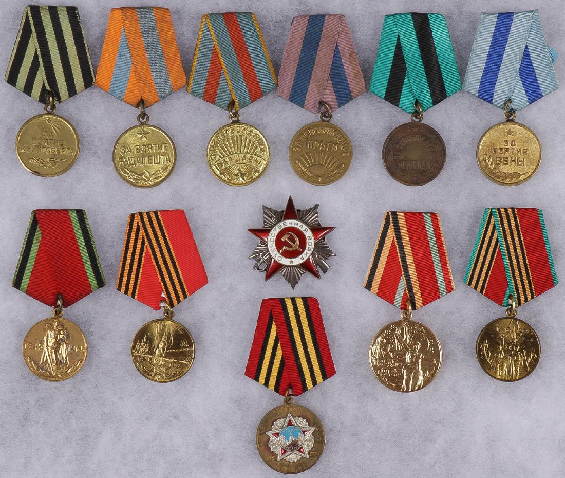 SOVIET MEDALS, ORDERS & PINS, CIRCA 1947-1995: SOVIET MEDALS, ORDERS & PINS, CIRCA 1947-1995. Comprising over 30 individual items including the Order of the Patriotic War 2nd class, liberation medals for Konigsberg, Budapest, Warsaw, Prague, Belgr