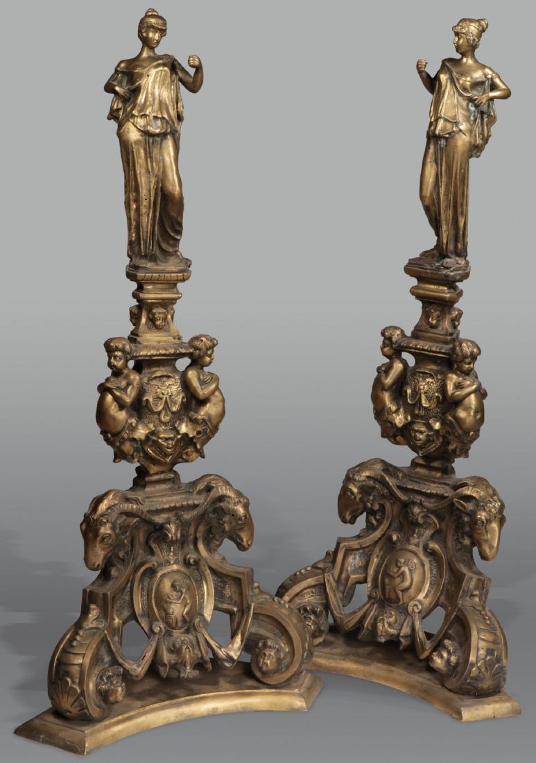 IMPRESSIVE BRONZE FIGURAL ANDIRON ENDS: A PAIR OF LARGE AND IMPRESSIVE BRONZE FIGURAL ANDIRON ENDS. Comprising two matching andiron ends resting on open work scrolled bases with putti and rams heads. Supporting a central node upon which res