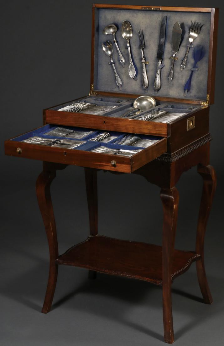 CONTINENTAL FLATWARE, SERVICE FOR 12, C 1900: A CASED SET OF CONTINENTAL FLATWARE, SERVICE FOR TWELVE, CIRCA 1900. The substantial matching set of German silver flatware decorated in the Rocaille taste and each piece stamped with crossed pennant 