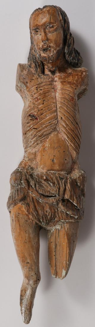 A CARVED CORPUS CHRISTI, 18TH CENTURY: A CARVED CORPUS CHRISTI, 18TH CENTURY. Comprising a fragment of a carved and polychrome Corpus Christi from a crucifix with exaggerated carved ribs and flat back. Overall height 18 inches (46 cm). SHI