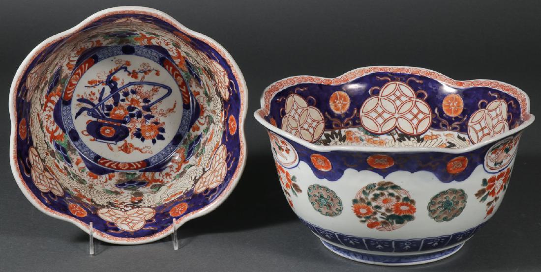 A PAIR OF LARGE JAPANESE IMARI TULIP BOWLS, MEIJI: A PAIR OF LARGE JAPANESE IMARI TULIP BOWLS, MEIJI. Overall decorated on the exterior and interior displaying traditional motifs throughout and each resting on a ringed foot. Greatest diameter 12.6 inc