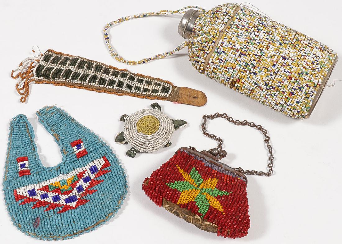 A GROUP OF PLAINS BEADED ITEMS, C. 1890-1915: A GROUP OF PLAINS BEADED ITEMS, C. 1890-1915. Comprising a trapezoid shaped sinew-sewn and beaded fob (length 6.5 inches), a beaded glass flask (height 5.75 inches), a beaded turtle effigy fet