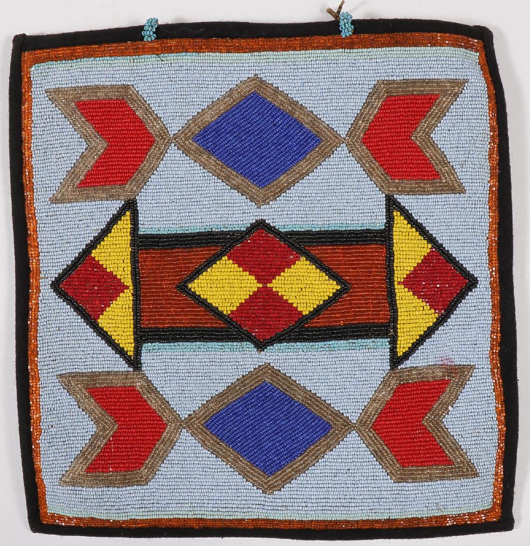 A PLATEAU BEADED BAG, 20TH C: A PLATEAU BEADED BAG, 20TH C. Profusely beaded with geometric patterns and with cloth border. 11.5 inches x 11 inches. SHIPPING NOTICE: Jackson's is your sole and only source for one st
