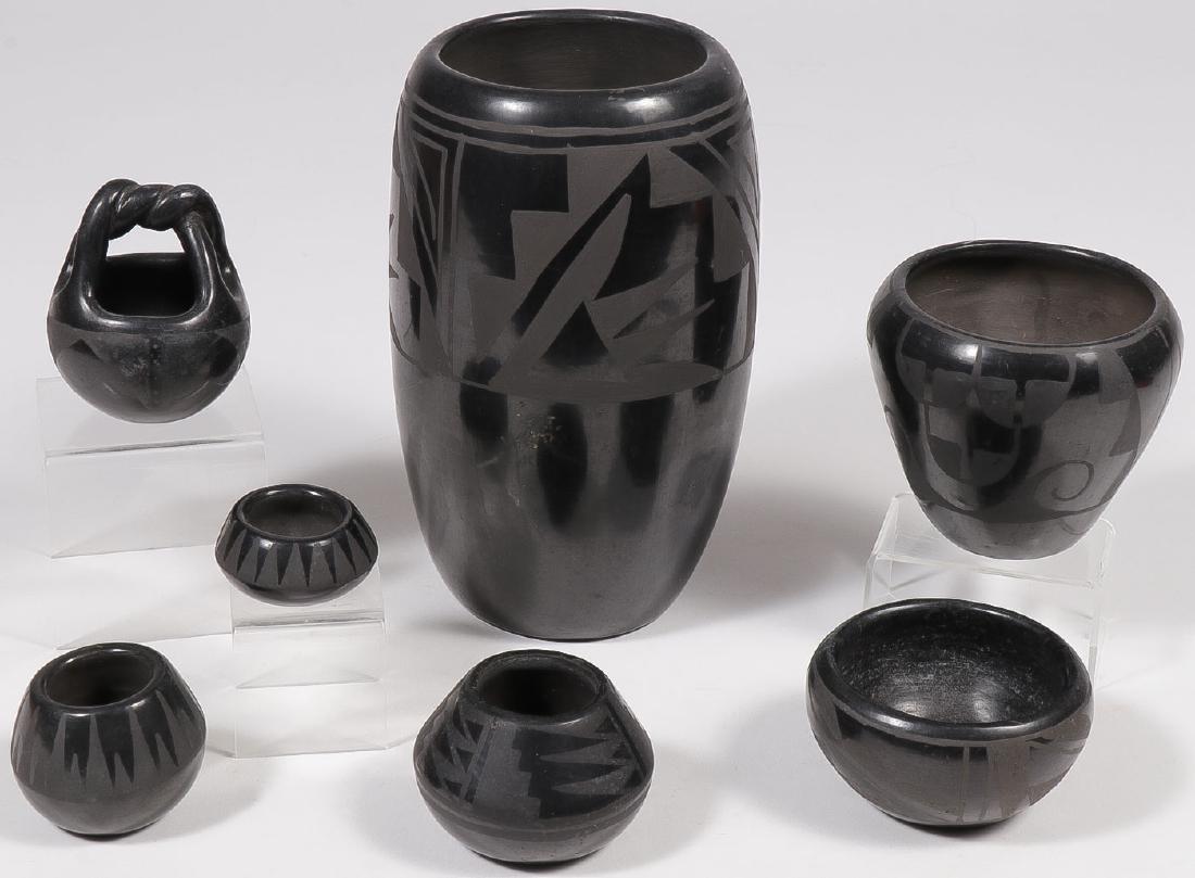 7 SOUTHWEST BLACKWARE POTTERY VESSELS: 7 SOUTHWEST BLACKWARE POTTERY VESSELS. Including various shapes, sizes, and designs. One piece (bottom row center) signed "Blue Corn San Ildefonso Pueblo." Greatest height 8.5 inches. SHIPPI
