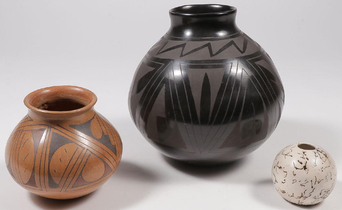 THREE SOUTHWEST STYLE POTTERY VASES: THREE SOUTHWEST STYLE POTTERY VASES. Greatest height 10 inches. SHIPPING NOTICE: Jackson's is your sole and only source for one stop packing and shipping. With over 50 years of experienc