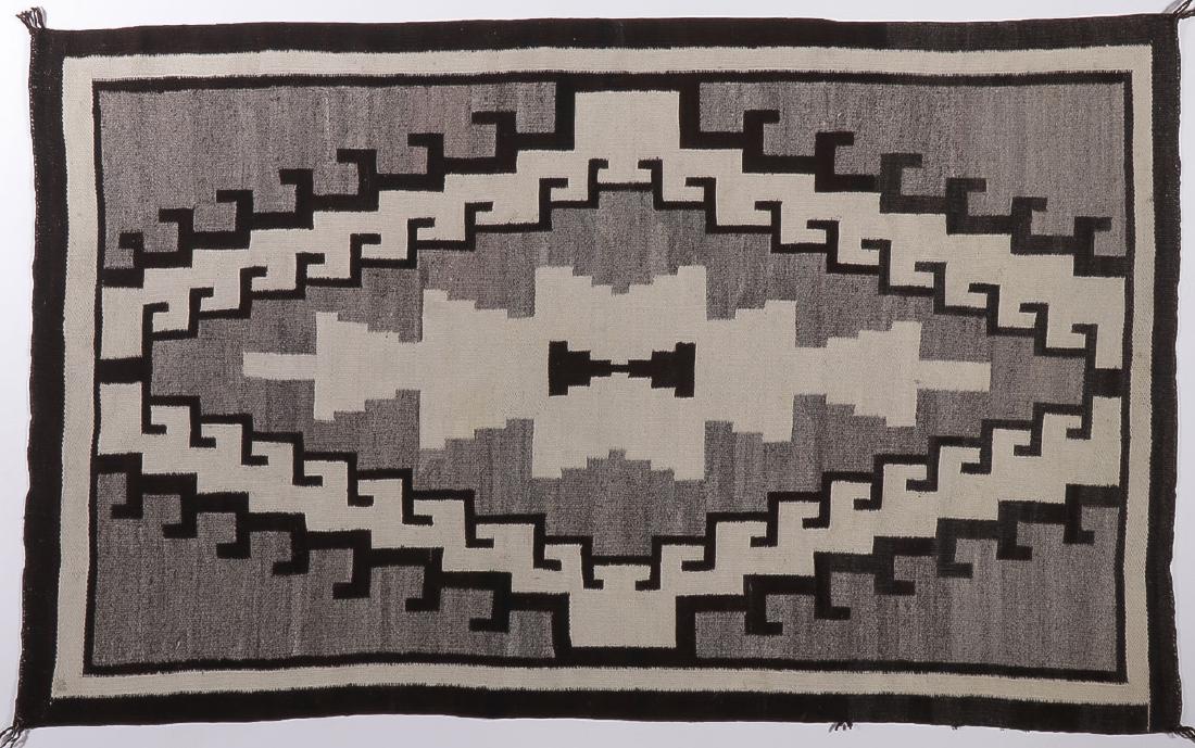 A NAVAJO TWO GREY HILLS RUG: A NAVAJO TWO GREY HILLS RUG. 40 inches x 65.25 inches. SHIPPING NOTICE: Jackson's is your sole and only source for one stop packing and shipping. With over 50 years of experience, our pro