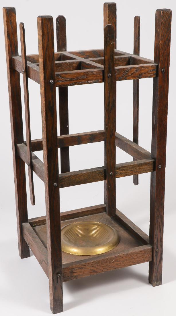AN OAK ARTS AND CRAFTS UMBRELLA STAND: AN OAK ARTS AND CRAFTS UMBRELLA STAND. Fumed oak with brass drip tray. Height 28 inches. SHIPPING NOTICE: Jackson's is your sole and only source for one stop packing and shipping. With ov