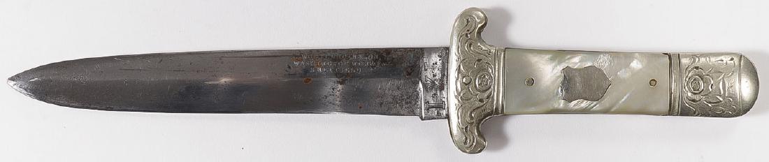 WOSTENHOLM & SON MOP BOWIE KNIFE: WOSTENHOLM & SON MOP BOWIE KNIFE. 5.5-inch spear point single edge blade, stamped G WOSTENHOLM & SON, WASHINGTON WORKS, SHEFFIELD" and the Wostenholm trademark “I*XL” on ricasso. With orna