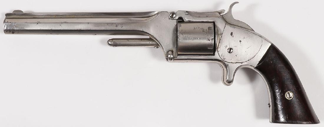A SMITH & WESSON NO. 2 OLD MODEL ARMY REVOLVER: A SMITH & WESSON NO. 2 OLD MODEL ARMY REVOLVER. Serial number 23479, caliber .32 rimfire, 6-shot, 6-inch octagonal barrel, rosewood grips, nickel finish, overall tight, crisp action. SHIPPING