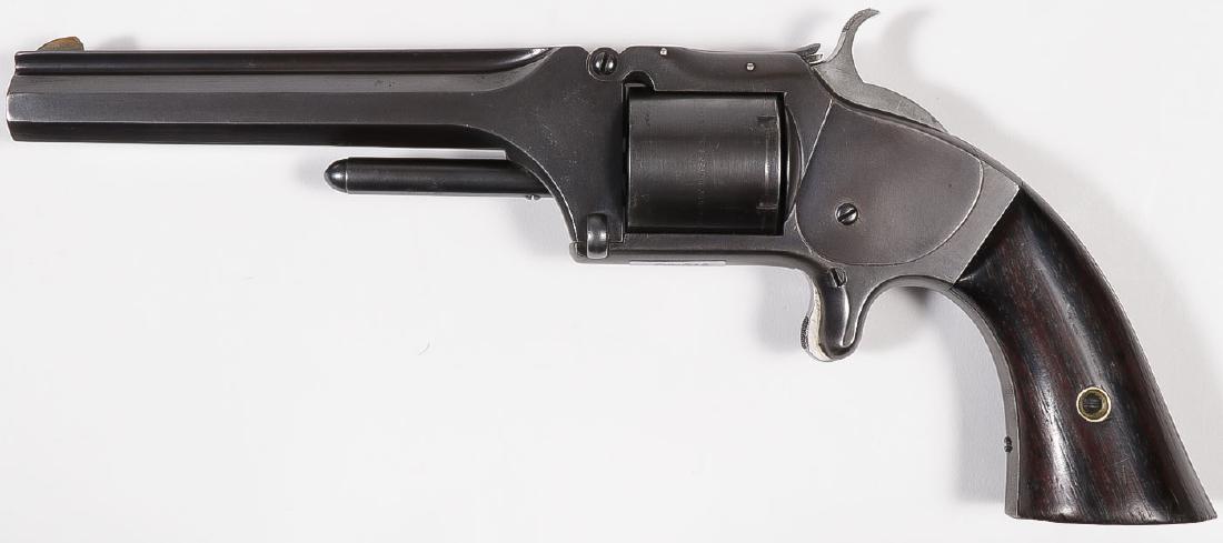 A SMITH & WESSON NO. 2 OLD MODEL ARMY REVOLVER: A SMITH & WESSON NO. 2 OLD MODEL ARMY REVOLVER. Serial number 62266, caliber .32 rimfire, 6-shot, 5-inch octagonal barrel, patent dates on cylinder, rosewood grips, blued finish (likely re