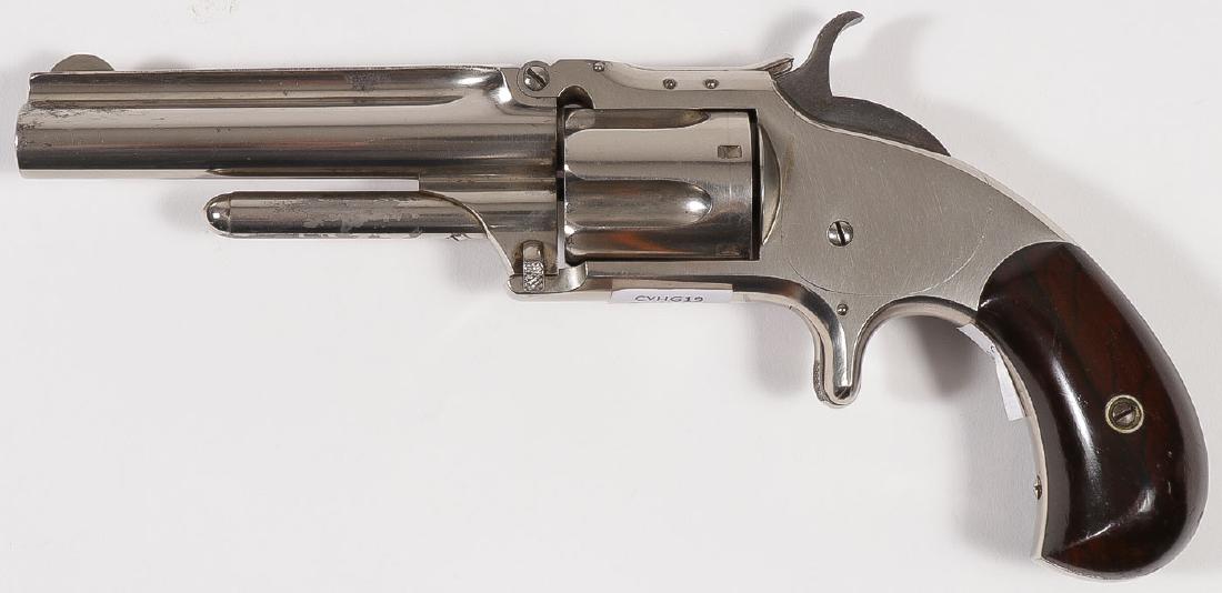 A SMITH & WESSON NO. 1 ½ SECOND ISSUE REVOLVER: A SMITH & WESSON NO. 1 ½ SECOND ISSUE REVOLVER. Serial number 112159, caliber .32 S & W, 5-shot, 3.5-inch barrel, patent dates on top of barrel, rosewood grips on bird's head butt, nickel