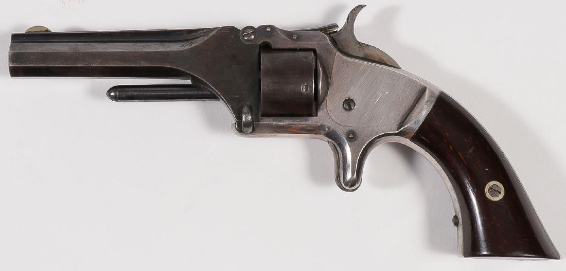 A SMITH & WESSON NO. 1 SECOND ISSUE .22 CAL REVOL: A SMITH & WESSON NO. 1 SECOND ISSUE .22 CAL REVOLVER. Serial number 28707, caliber .22, 7-shot, 3.1-inch octagonal barrel, patent dates on cylinder, rosewood grips on bird's head butt, blu