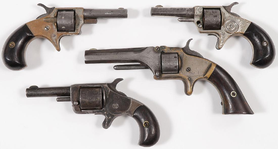 FOUR SPUR TRIGGER POCKET REVOLVERS, 19TH CENTURY: FOUR SPUR TRIGGER POCKET REVOLVERS, 19TH CENTURY. Comprising a Smith & Wesson model number 1 second issue revolver, .22 caliber, 7-shot fluted cylinder with 3.1-inch barrel, spur trigger, and
