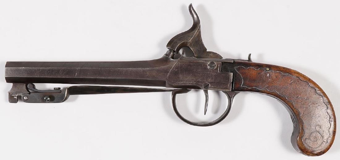 A PERCUSSION BAYONET PISTOL: A PERCUSSION BAYONET PISTOL. .52 caliber with 5-inch barrel set with spring operated bayonet on underside of barrel released by trigger guard and with center percussion lock with inset wire decora
