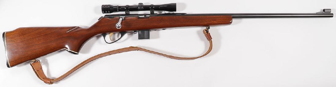 A MARLIN MODEL 980-DL .22 MAG RIFLE: A MARLIN MODEL 980-DL .22 MAG RIFLE. Serial number, none. Bolt action, 24-inch barrel, wood stock, hooded front blade sight, step adjustable rear sight, Redfield 4X scope mounted on grooved re