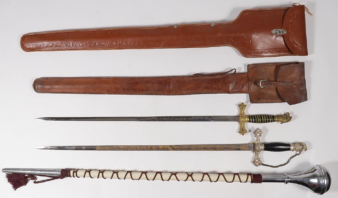 A PAIR OF LODGE SWORDS: A PAIR OF LODGE SWORDS. Each with finely etched and personalized named blade, one by George E. Benz Co, St Louis, the other by M. C. Lilley, Columbus, OH, and both with leather carrying cases. Togethe