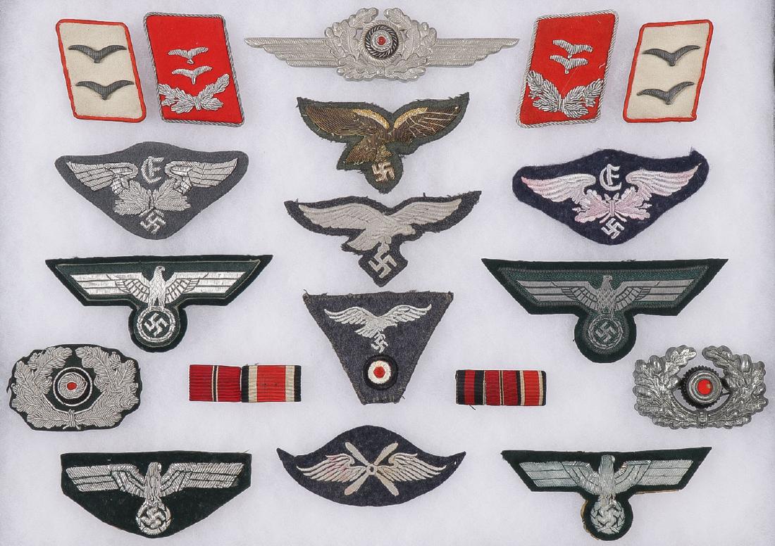 GROUP OF GERMAN WWII MOSTLY LUFTWAFFE INSIGNIA: GROUP OF GERMAN WWII MOSTLY LUFTWAFFE INSIGNIA. Comprising over 20 individual pieces including a Luft officer's aluminum cockade, Luft officer flak collar tabs including matching pair of Hermann G