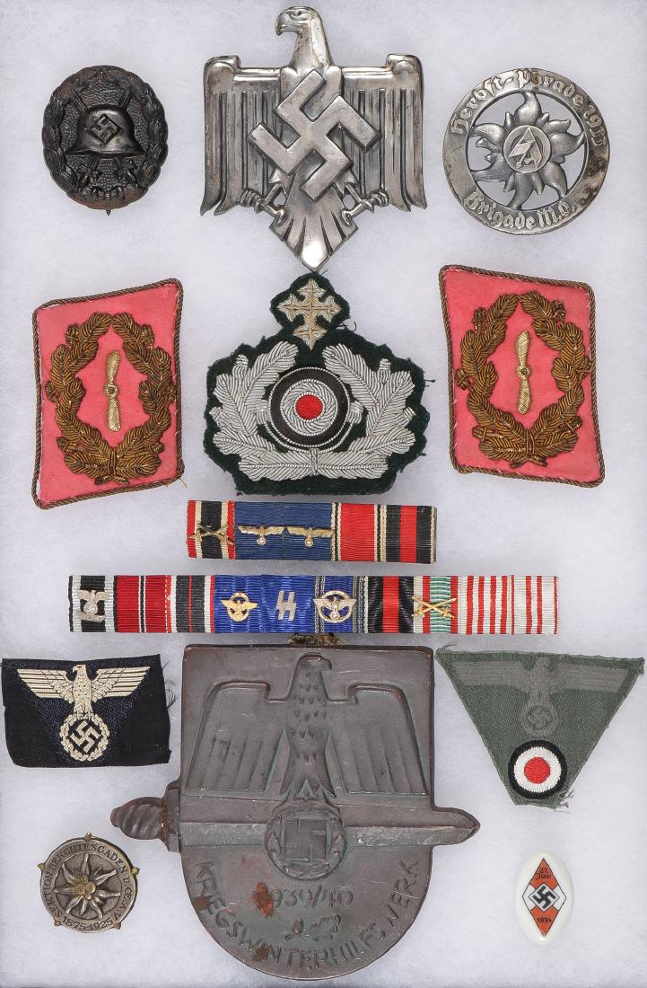 GOOD GROUP OF GERMAN WWII INSIGNIA: GOOD GROUP OF GERMAN WWII INSIGNIA. Comprising a dozen vintage items including a black wound badge, a nice large silvered DRL eagle with screw post on verso, height 81 mm, a good 1933 SA Brigade Autum