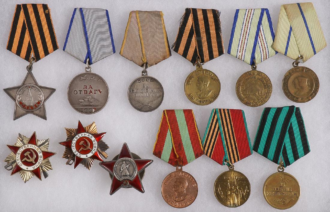SOVIET RUSSIAN MEDALS: SOVIET RUSSIAN MEDALS. Comprising twelve mostly WWII issued Soviet medals and badges including a numbered Order of Glory, a Medal for Bravery, verso with stamped issuance number 3521293, a combat serv