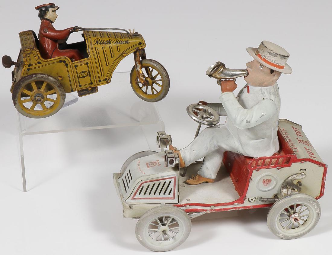 TWO GERMAN TIN WIND-UPS: TWO GERMAN TIN WIND-UPS. Comprising a good Lehmann tin wind-up Tut Tut in good to very good condition, takes a wind and runs. Length 7 inches. Together with a tin wind-up Ruck Ruck three w