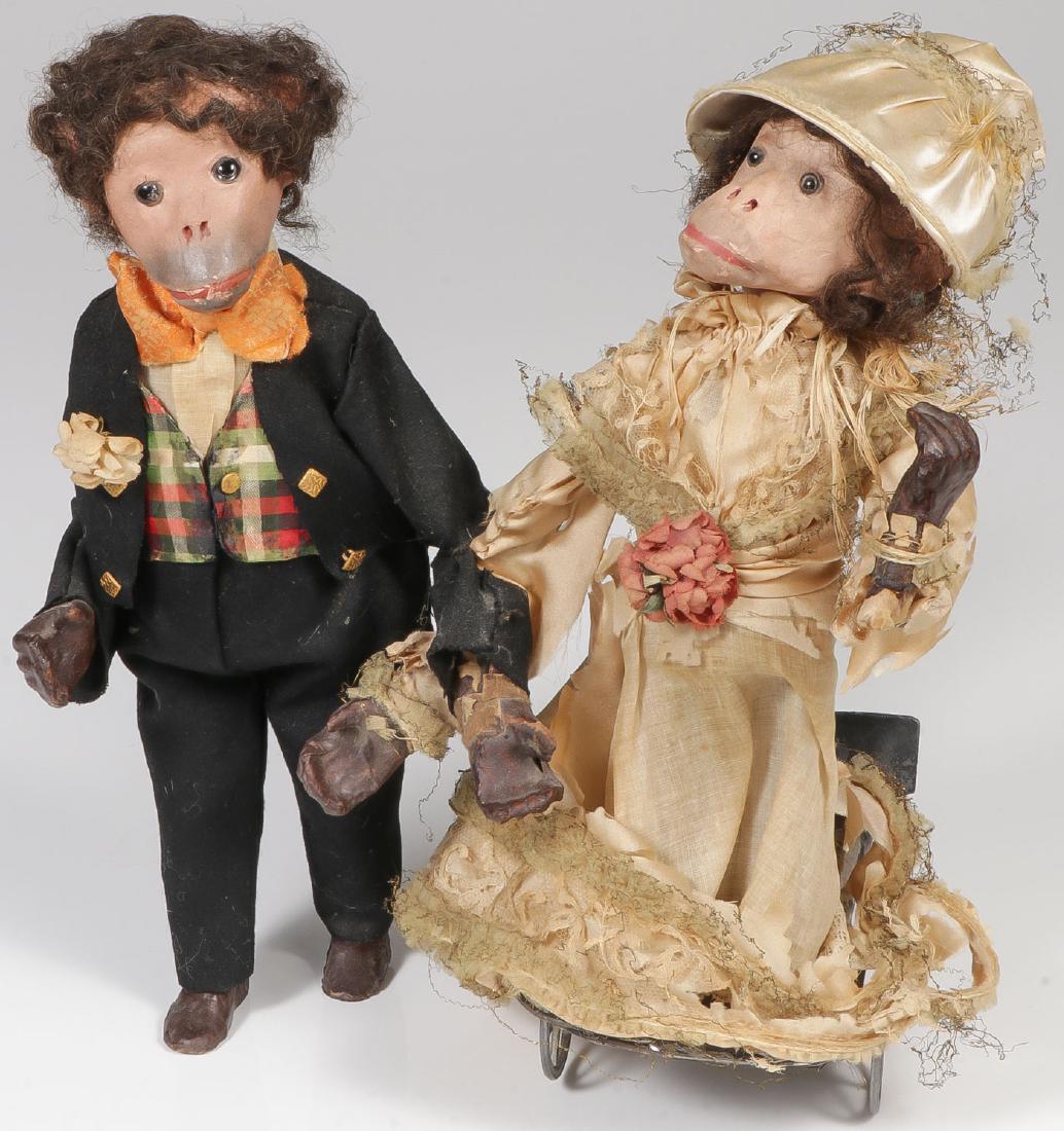 EARLY MECHANICAL MONKEY BRIDE & GROOM, C 1890: EARLY MECHANICAL MONKEY BRIDE & GROOM, C. 1890. Comprising a pair of monkeys with papier-mache head with glass eyes and composition hands, dressed as bride and groom and set on an articulated osci