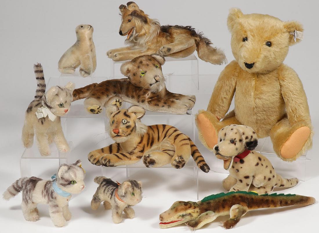 10 STEIFF/STEIFF-LIKE ANIMALS: 10 STEIFF/STEIFF-LIKE ANIMALS. Including a Steiff marked mohair teddy, length 17 inches, a Steiff marked alligator, a Steiff marked "Lizzy the Kitten," a Steiff marked seated collie, anoth