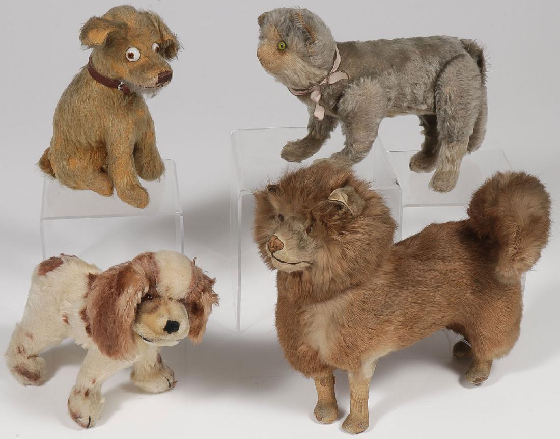 9 VINTAGE MOHAIR BEARS & OTHER ANIMALS: 9 VINTAGE MOHAIR BEARS & OTHER ANIMALS, C. 1910-1930. Comprising a nice large French dog candy container with papier-mache body, real fur, glass eyes, head pulls off to reveal foil lined candy
